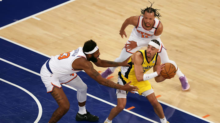 May 21, 2025; New York, New York, USA; Indiana Pacers guard Andrew Nembhard (2) controls the ball against New York Knicks center Mitchell Robinson (23) in the first quarter during game one of the eastern conference finals for the 2025 NBA Playoffs at Madison Square Garden. Mandatory Credit: Brad Penner-Imagn Images