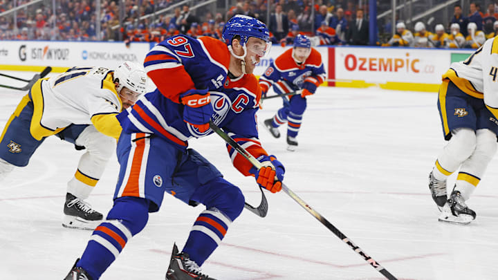 Jan 6, 2026; Edmonton, Alberta, CAN; Edmonton Oilers forward Connor McDavid (97) carries the puck around Nashville Predators defensemen Nicolas Hague (41) during the third period at Rogers Place. Mandatory Credit: Perry Nelson-Imagn Images Jan 6, 2026; Edmonton, Alberta, CAN; Edmonton Oilers forward Connor McDavid (97) carries the puck around Nashville Predators defensemen Nicolas Hague (41) during the third period at Rogers Place. Mandatory Credit: Perry Nelson-Imagn Images