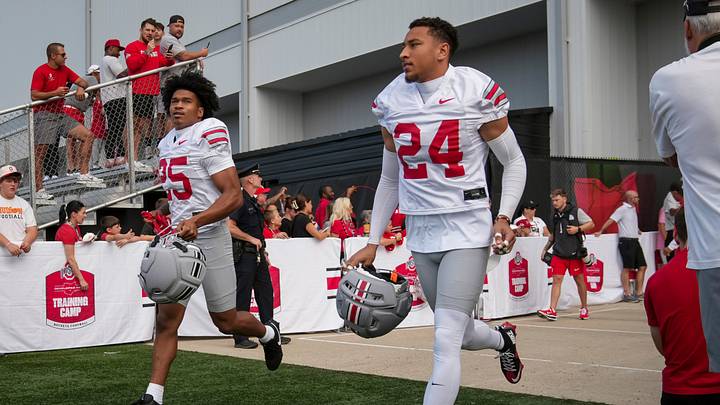 Ohio State Buckeyes cornerback Dominick Kelly (24) and cornerback Jay Timmons (25) take the field during the first practice of training camp at the Woody Hayes Athletic Center in Columbus on Aug. 6, 2026. Ohio State Buckeyes cornerback Dominick Kelly (24) and cornerback Jay Timmons (25) take the field during the first practice of training camp at the Woody Hayes Athletic Center in Columbus on Aug. 6, 2026.