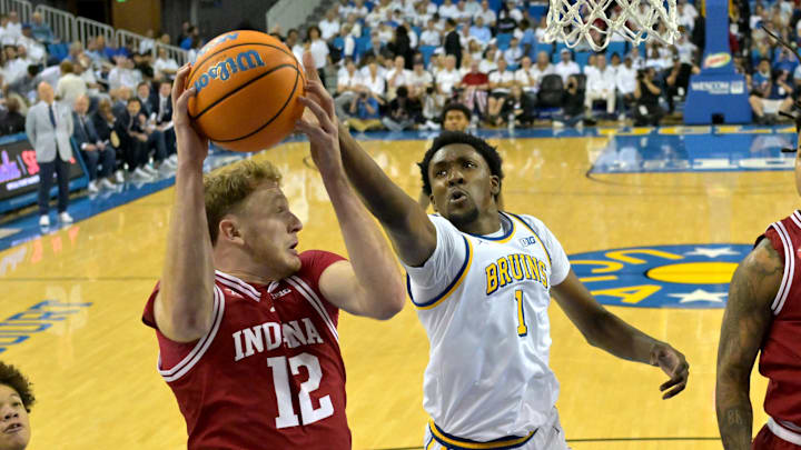 Jan 31, 2026; Los Angeles, California, USA; Indiana Hoosiers forward Tucker DeVries (12) and UCLA Bruins forward Xavier Booker (1) go for a rebound in the first half at Pauley Pavilion presented by Wescom Financial. Mandatory Credit: Jayne Kamin-Oncea-Imagn Images Jan 31, 2026; Los Angeles, California, USA; Indiana Hoosiers forward Tucker DeVries (12) and UCLA Bruins forward Xavier Booker (1) go for a rebound in the first half at Pauley Pavilion presented by Wescom Financial. Mandatory Credit: Jayne Kamin-Oncea-Imagn Images