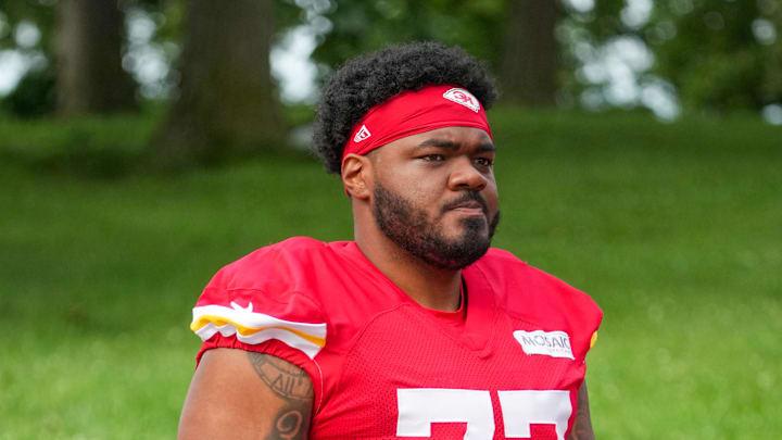 Jul 22, 2025; St. Joseph, MO, USA; Kansas City Chiefs guard Jaylon Moore (77) walks down the hill to the practice fields during training camp at Missouri Western State University. Mandatory Credit: Denny Medley-Imagn Images