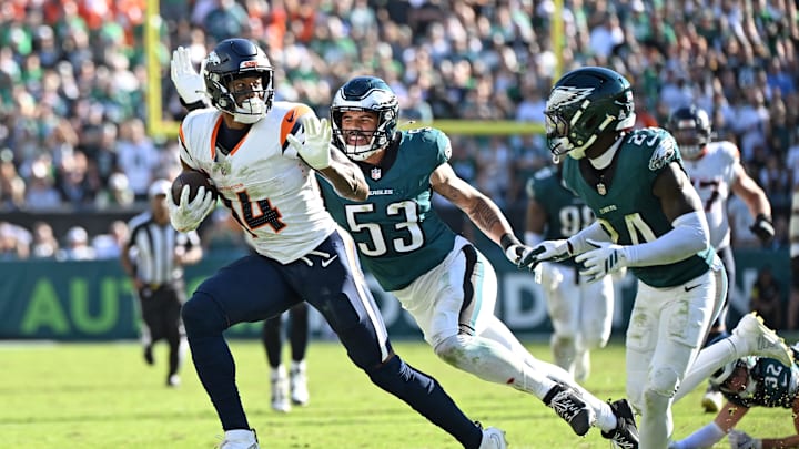 Oct 5, 2025; Philadelphia, Pennsylvania, USA; Denver Broncos wide receiver Courtland Sutton (14) runs past Philadelphia Eagles linebacker Zack Baun (53) and safety Andrew Mukuba (24) at Lincoln Financial Field. 