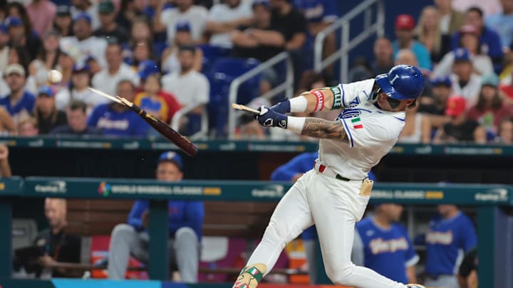 Mar 16, 2026; Miami, FL, United States; Italy third baseman Andrew Fischer (11) hits a broken bat single in the fourth inning against Venezuela during a semifinal game of the 2026 World Baseball Classic at loanDepot Park. Mandatory Credit: Sam Navarro-Imagn Images