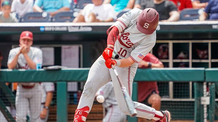 Jun 17, 2023; Omaha, NE, USA; Stanford Cardinal catcher Malcolm Moore (10) hits a single against the