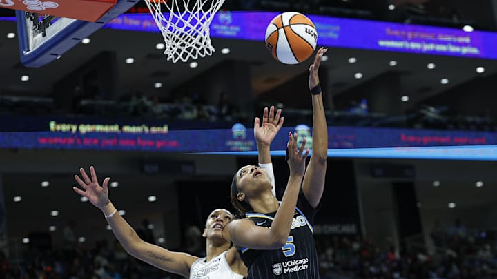 Aug 25, 2025; Chicago, Illinois, USA; Chicago Sky forward Angel Reese (5) drives to the basket against Las Vegas Aces center A'ja Wilson (22) during the first half at Wintrust Arena. Mandatory Credit: Kamil Krzaczynski-Imagn Images