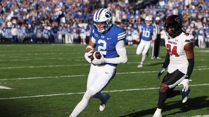 Oct 21, 2023; Provo, Utah, USA; Brigham Young Cougars wide receiver Chase Roberts (2) scores a touchdown against Texas Tech Red Raiders defensive back Malik Dunlap (24) in the first quarter at LaVell Edwards Stadium. Mandatory Credit: Rob Gray-USA TODAY Sports