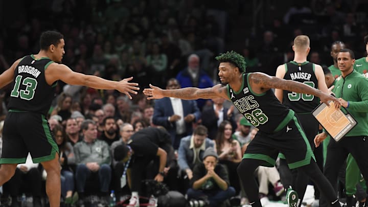 Dec 2, 2022; Boston, Massachusetts, USA; Boston Celtics guard Marcus Smart (36) congratulates guard Malcolm Brogdon (13) after a basket during the second half at TD Garden. Mandatory Credit: Bob DeChiara-Imagn Images