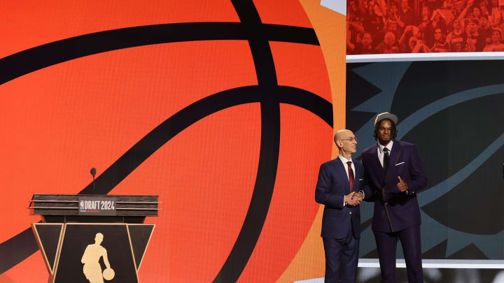 Jun 26, 2024; Brooklyn, NY, USA; DaRon Holmes ll poses for photos with NBA commissioner Adam Silver after being selected in the first round by the Phoenix Suns in the 2024 NBA Draft at Barclays Center. Mandatory Credit: Brad Penner-USA TODAY Sports