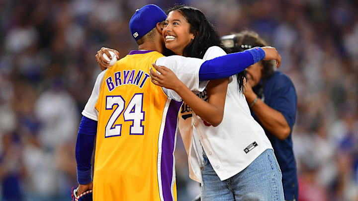 Natalia Bryant is greeted by Los Angeles Dodgers right fielder Mookie Betts (50) after throwing out the ceremoninial first pitch. Natalia Bryant is greeted by Los Angeles Dodgers right fielder Mookie Betts (50) after throwing out the ceremoninial first pitch.