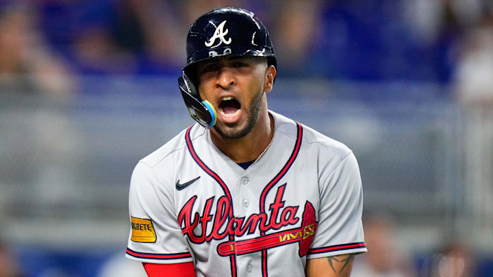 Sep 17, 2023; Miami, Florida, USA; Atlanta Braves outfielder Eddie Rosario (8) reacts to being hit