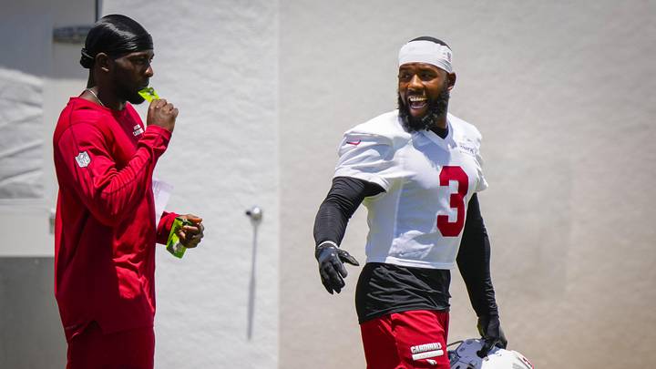 Arizona Cardinals defensive backs Budda Baker (3) and Garrett Williams (left) talk during organized team activities at the Cardinals Training Facility in Tempe on May 27, 2026.