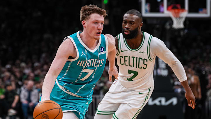 Charlotte Hornets guard Kon Knueppel (7) drives the ball against Boston Celtics guard Jaylen Brown 