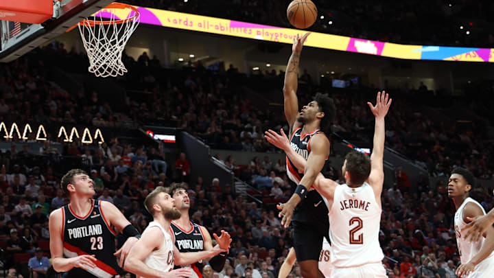 Mar 25, 2025; Portland, Oregon, USA;  Portland Trail Blazers guard Scoot Henderson (00) shoots the ball over Cleveland Cavaliers guard Ty Jerome (2) in the second half at Moda Center. Mandatory Credit: Jaime Valdez-Imagn Images