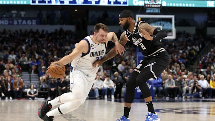 Nov 15, 2022; Dallas, Texas, USA; Dallas Mavericks guard Luka Doncic (77) dribbles as LA Clippers forward Marcus Morris Sr. (8) defends during the first quarter at American Airlines Center. Mandatory Credit: Kevin Jairaj-Imagn Images Nov 15, 2022; Dallas, Texas, USA; Dallas Mavericks guard Luka Doncic (77) dribbles as LA Clippers forward Marcus Morris Sr. (8) defends during the first quarter at American Airlines Center. Mandatory Credit: Kevin Jairaj-Imagn Images