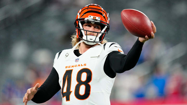 Cincinnati Bengals long snapper Cal Adomitis (48) catches a ball as he prepares for the game, Sunday, October 13, 2024, in East Rutherford.