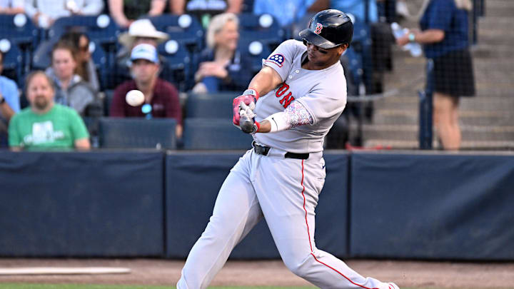 Apr 15, 2025; St. Petersburg, Florida, USA; Boston Red Sox designated hitter Rafael Devers hits a double in the first inning against the Tampa Bay Rays. All players wore number 42 for Jackie Robinson Day at George M. Steinbrenner Field. Mandatory Credit: Jonathan Dyer-Imagn Images Apr 15, 2025; St. Petersburg, Florida, USA; Boston Red Sox designated hitter Rafael Devers hits a double in the first inning against the Tampa Bay Rays. All players wore number 42 for Jackie Robinson Day at George M. Steinbrenner Field. Mandatory Credit: Jonathan Dyer-Imagn Images