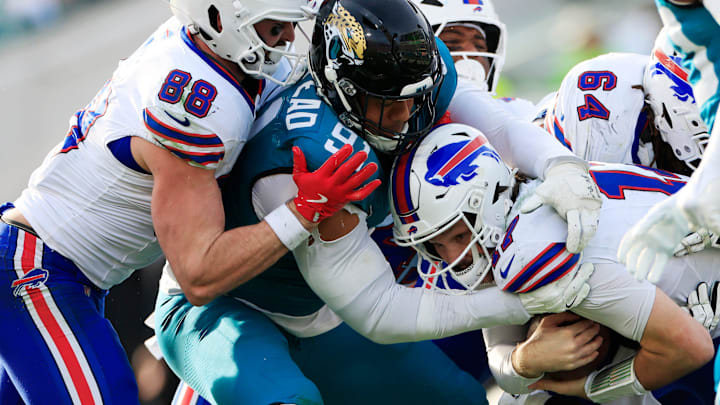 Buffalo Bills quarterback Josh Allen (17), center, is short of the goal line as Jacksonville Jaguars defensive tackle Arik Armstead (91) and safety Antonio Johnson (26) make the stop during the fourth quarter of an NFL football AFC Wild Card playoff matchup, Sunday, Jan. 11, 2026, in Jacksonville, Fla. The Bills defeated the Jaguars 27-24. [Corey Perrine/Florida Times-Union]