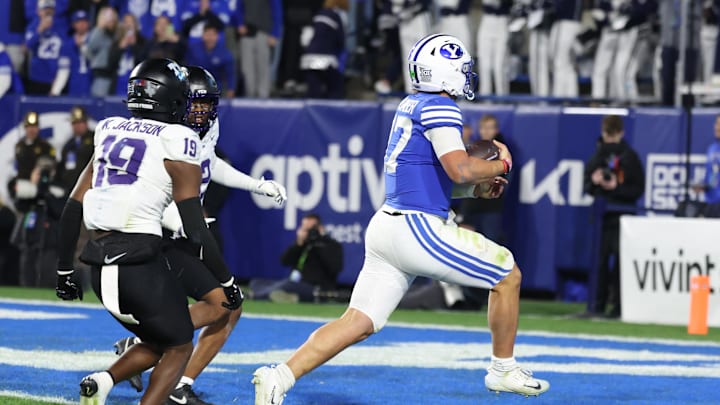 Nov 15, 2025; Provo, Utah, USA; BYU Cougars quarterback Bear Bachmeier (47) runs for a touchdown against the Texas Christian University Horned Frogs during the second quarter at LaVell Edwards Stadium. Mandatory Credit: Rob Gray-Imagn Images