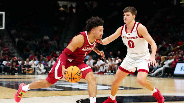 Nov 27, 2024; Las Vegas, Nevada, USA; Alabama Crimson Tide guard Mark Sears (1) dribbles against Rutgers Scarlet Knights guard Jordan Derkack (0) during the second half at MGM Grand Garden Arena. Mandatory Credit: Stephen R. Sylvanie-Imagn Images