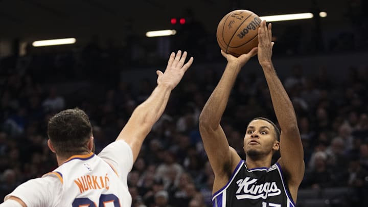 November 13, 2024; Sacramento, California, USA; Sacramento Kings forward Keegan Murray (13) shoots the basketball against Phoenix Suns center Jusuf Nurkic (20) during the second quarter at Golden 1 Center. Mandatory Credit: Kyle Terada-Imagn Images