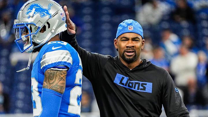 Detroit Lions wide receivers coach Antwaan Randle El cheers on cornerback Carlton Davis III (23) during warm up before the Tennessee Titans game at Ford Field in Detroit on Sunday, Oct. 27, 2024.