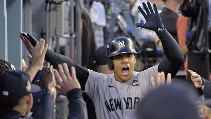 Oct 26, 2024; Los Angeles, California, USA; New York Yankees outfielder Juan Soto (22) celebrates in the dugout after hitting a solo home run in the third inning against the Los Angeles Dodgers during game two of the 2024 MLB World Series at Dodger Stadium. Mandatory Credit: Jayne Kamin-Oncea-Imagn Images