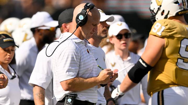 Sep 12, 2026; Nashville, Tennessee, USA; Vanderbilt Commodores head coach Clark Lea goes over his notes against the Delaware Blue Hens during the first half at FirstBank Stadium. Mandatory Credit: Steve Roberts-Imagn Images Sep 12, 2026; Nashville, Tennessee, USA; Vanderbilt Commodores head coach Clark Lea goes over his notes against the Delaware Blue Hens during the first half at FirstBank Stadium. Mandatory Credit: Steve Roberts-Imagn Images