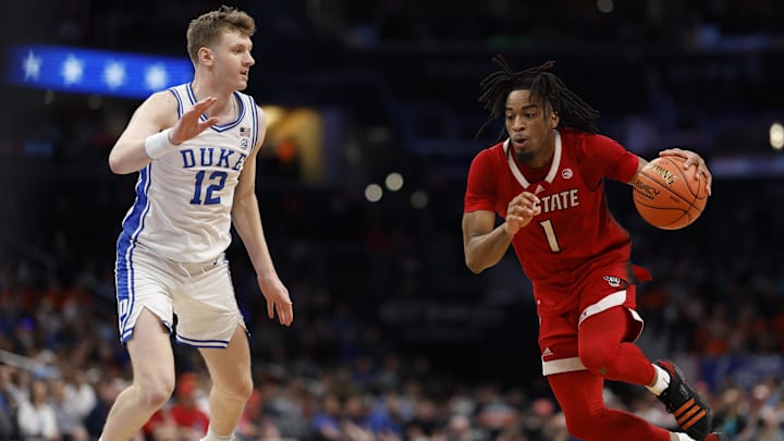 Mar 14, 2024; Washington, D.C., USA; North Carolina State guard Jayden Taylor (1) drives to the basket.