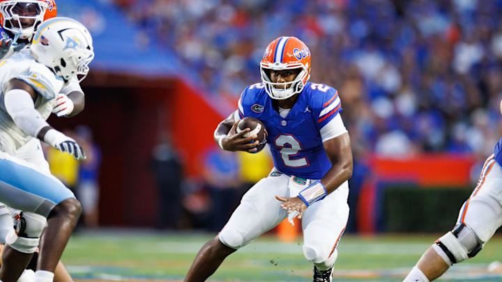 Aug 30, 2025; Gainesville, Florida, USA; Florida Gators quarterback DJ Lagway (2) scrambles with the ball against the Long Island Sharks during the first half at Ben Hill Griffin Stadium. Mandatory Credit: Matt Pendleton-Imagn Images