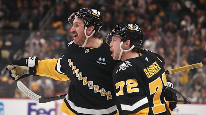 Feb 4, 2025; Pittsburgh, Pennsylvania, USA;  Pittsburgh Penguins left wing Anthony Beauvillier (72) and right wing Kevin Hayes (13) celebrate a goal by Hayes against the New Jersey Devils during the third period at PPG Paints Arena. Mandatory Credit: Charles LeClaire-Imagn Images