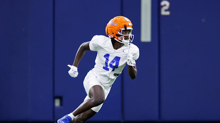 Florida Gators wide receiver Muizz Tounkara (14) runs during fall football practice at Sanders Indoor Practice Facility at the University of Florida in Gainesville, FL on Thursday, August 14, 2025. Florida Gators wide receiver Muizz Tounkara (14) runs during fall football practice at Sanders Indoor Practice Facility at the University of Florida in Gainesville, FL on Thursday, August 14, 2025.