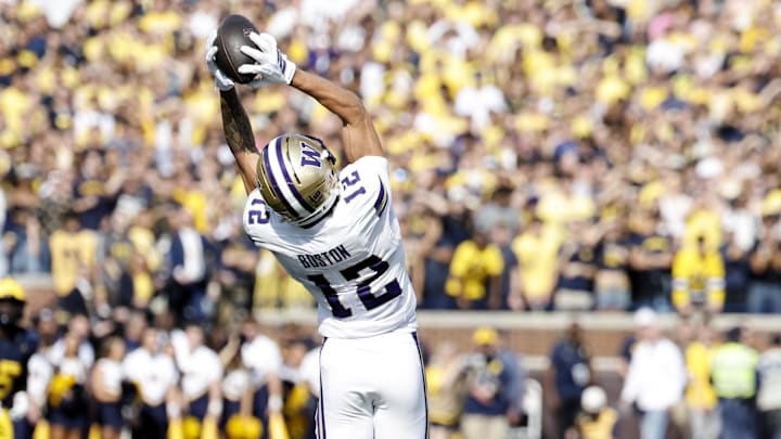 Oct 18, 2025; Ann Arbor, Michigan, USA;  Washington Huskies wide receiver Denzel Boston (12) makes a reception in the first half against the Michigan Wolverines at Michigan Stadium. Mandatory Credit: Rick Osentoski-Imagn Images