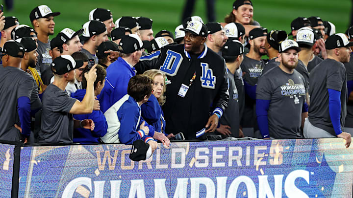 Oct 31, 2024; New York, USA, LAD; Los Angeles Dodgers owner Magic Johnson celebrates after the Los Angeles Dodgers beat the New York Yankees in game five to win the 2024 Imagn Images World Series at New York. Mandatory Credit: Wendell Cruz-Imagn Images Oct 31, 2024; New York, USA, LAD; Los Angeles Dodgers owner Magic Johnson celebrates after the Los Angeles Dodgers beat the New York Yankees in game five to win the 2024 Imagn Images World Series at New York. Mandatory Credit: Wendell Cruz-Imagn Images