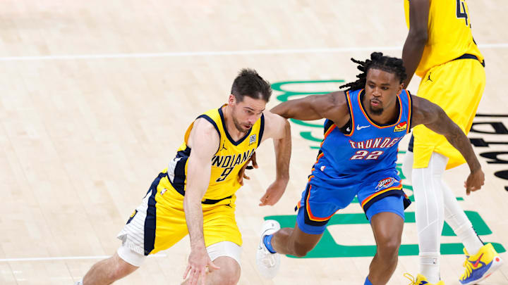 Jun 22, 2025; Oklahoma City, Oklahoma, USA; Indiana Pacers guard T.J. McConnell (9) dribbles the ball against Oklahoma City Thunder guard Cason Wallace (22) during the second half of game seven of the 2025 NBA Finals at Paycom Center. Mandatory Credit: Alonzo Adams-Imagn Images