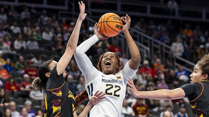 Mar 6, 2026; Kansas City, MO, USA; West Virginia forward Kierra Wheeler (22) attempts a contested shot against Arizona State during the first half at T-Mobile Center. Mandatory Credit: Nick Tre. Smith-Imagn Images Mar 6, 2026; Kansas City, MO, USA; West Virginia forward Kierra Wheeler (22) attempts a contested shot against Arizona State during the first half at T-Mobile Center. Mandatory Credit: Nick Tre. Smith-Imagn Images