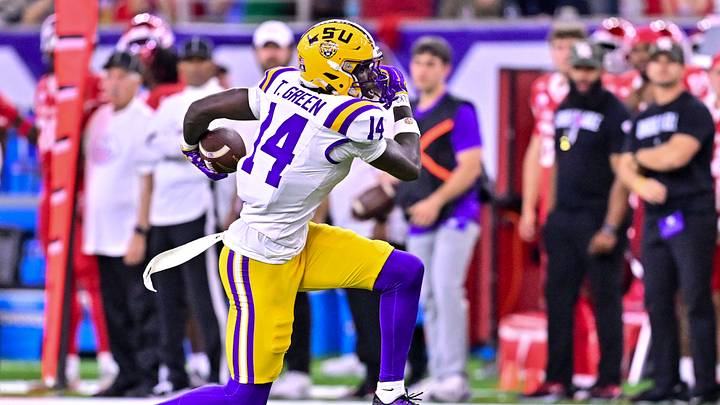 Dec 27, 2025; Houston, TX, USA; Louisiana State Tigers tight end Trey'Dez Green (14) runs the ball during the second half against the Houston Cougars at NRG Stadium. Mandatory Credit: Maria Lysaker-Imagn Images