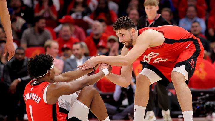 May 1, 2026; Houston, Texas, USA; Houston Rockets center Alperen Sengun (28) helps up Houston Rockets guard Amen Thompson (1) against the Los Angeles Lakers during the second quarter of game six of the first round of the 2026 NBA Playoffs at Toyota Center. Mandatory Credit: Erik Williams-Imagn Images