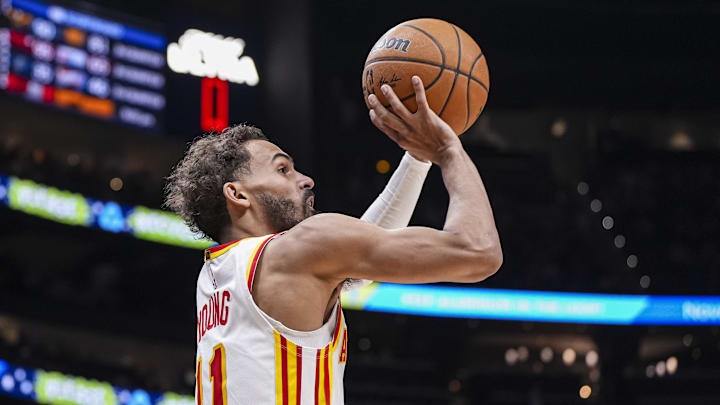 Feb 24, 2025; Atlanta, Georgia, USA; Atlanta Hawks guard Trae Young (11) shoots against the Miami Heat during the second half at State Farm Arena. Mandatory Credit: Dale Zanine-Imagn Images