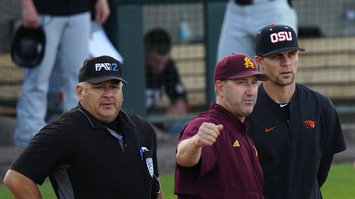 ASU head coach Willie Bloomquist talks with the umpires prior to a game against Oregon State at Phoenix Municipal Stadium on April 21, 2023. ASU head coach Willie Bloomquist talks with the umpires prior to a game against Oregon State at Phoenix Municipal Stadium on April 21, 2023.