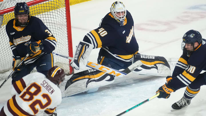 ASU Sun Devils forward Charlie Schoen (82) attempts a shot as Augustana Vikings goalie Zack Rose (40) defends the net at Mullett Arena in Tempe on Jan. 19, 2024.