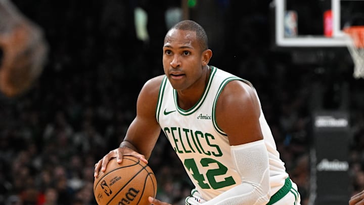 Nov 24, 2024; Boston, Massachusetts, USA; Boston Celtics center Al Horford (42) controls the ball against the Minnesota Timberwolves during the first half at TD Garden. Mandatory Credit: Eric Canha-Imagn Images