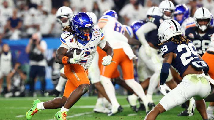 Dec 31, 2024; Glendale, AZ, USA; Boise State Broncos running back Ashton Jeanty (2) rushes the ball against the Penn State Nittany Lions during the second half in the Fiesta Bowl at State Farm Stadium. Mandatory Credit: Mark J. Rebilas-Imagn Images