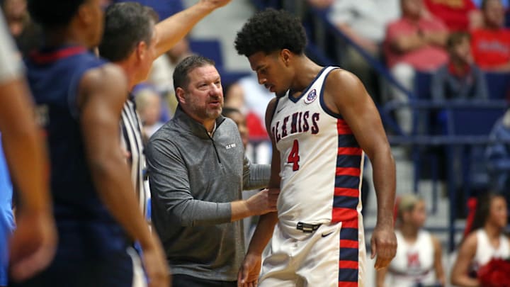 Nov 12, 2024; Oxford, Mississippi, USA; Mississippi Rebels head coach Chris Beard talks with Mississippi Rebels forward Jaemyn Brakefield (4) during the first half against the South Alabama Jaguars at C.M. 'Tad' Smith Coliseum. Mandatory Credit: Petre Thomas-Imagn Images Nov 12, 2024; Oxford, Mississippi, USA; Mississippi Rebels head coach Chris Beard talks with Mississippi Rebels forward Jaemyn Brakefield (4) during the first half against the South Alabama Jaguars at C.M. 'Tad' Smith Coliseum. Mandatory Credit: Petre Thomas-Imagn Images