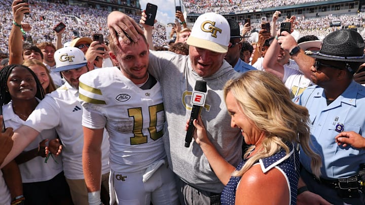 Sep 13, 2025; Atlanta, Georgia, USA; Georgia Tech Yellow Jackets quarterback Haynes King (10) and head coach Brent Key talk to a reporter after a victory over the Clemson Tigers at Bobby Dodd Stadium at Hyundai Field. Mandatory Credit: Brett Davis-Imagn Images