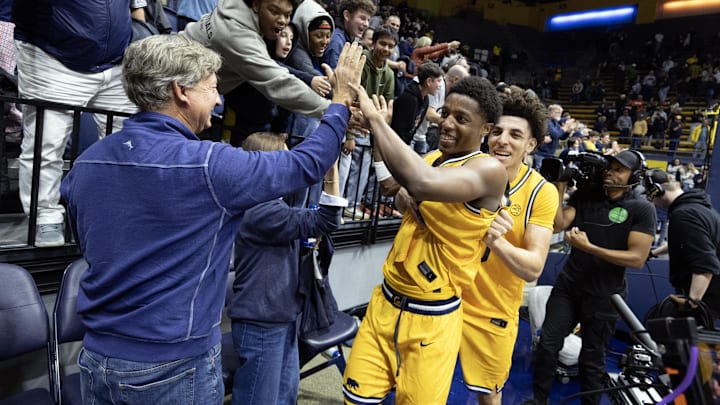 Dai Dai Ames and Justin Pippen celebrate a victory over Notre Dame