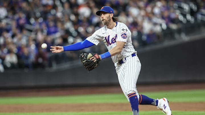 Aug 20, 2024; New York City, New York, USA;  New York Mets second baseman Jeff McNeil (1) makes a running throw to first base against the Baltimore Orioles in the third inning at Citi Field.