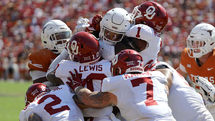 Oklahoma Sooners defensive back Billy Bowman Jr. (2), Oklahoma Sooners linebacker Kip Lewis (10), Oklahoma Sooners linebacker Jaren Kanak (7) and Oklahoma Sooners linebacker Dasan McCullough (1) stop Texas Longhorns running back Jonathon Brooks (24) during the Red River Rivalry college football game between the University of Oklahoma Sooners (OU) and the University of Texas (UT) Longhorns at the Cotton Bowl in Dallas, Saturday, Oct. 7, 2023. Oklahoma won 34-30.