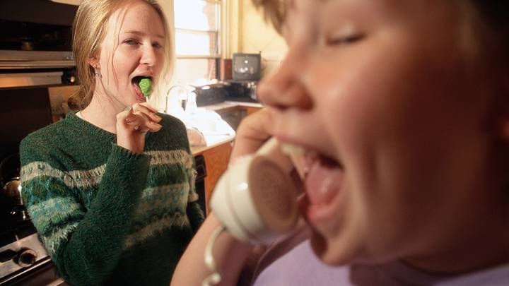 Girl Watching Friend Talking on Telephone Girl Watching Friend Talking on Telephone