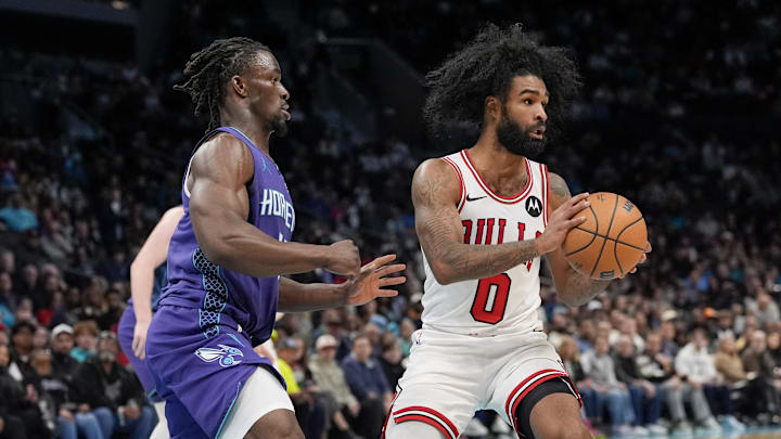 Dec 12, 2025; Charlotte, North Carolina, USA; Chicago Bulls guard Coby White (0) passes the ball under pressure by Charlotte Hornets guard Sion James (4) during the second half at Spectrum Center. Mandatory Credit: Jim Dedmon-Imagn Images Dec 12, 2025; Charlotte, North Carolina, USA; Chicago Bulls guard Coby White (0) passes the ball under pressure by Charlotte Hornets guard Sion James (4) during the second half at Spectrum Center. Mandatory Credit: Jim Dedmon-Imagn Images