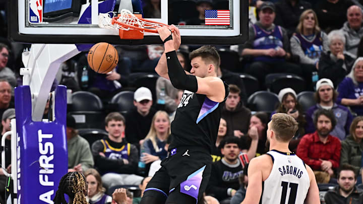 Feb 26, 2025; Salt Lake City, Utah, USA;  Utah Jazz center Walker Kessler (24) dunks in the first half against the Sacramento Kings at Delta Center. Mandatory Credit: Jamie Sabau-Imagn Images